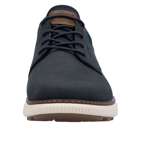 Front view of a dark blue dress shoe with brown accents and white soles