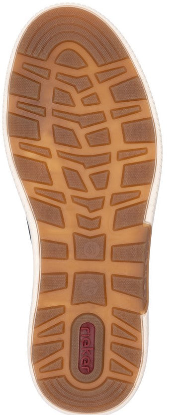The sole of a shoe reveals a brown tread pattern with a logo at the heel.