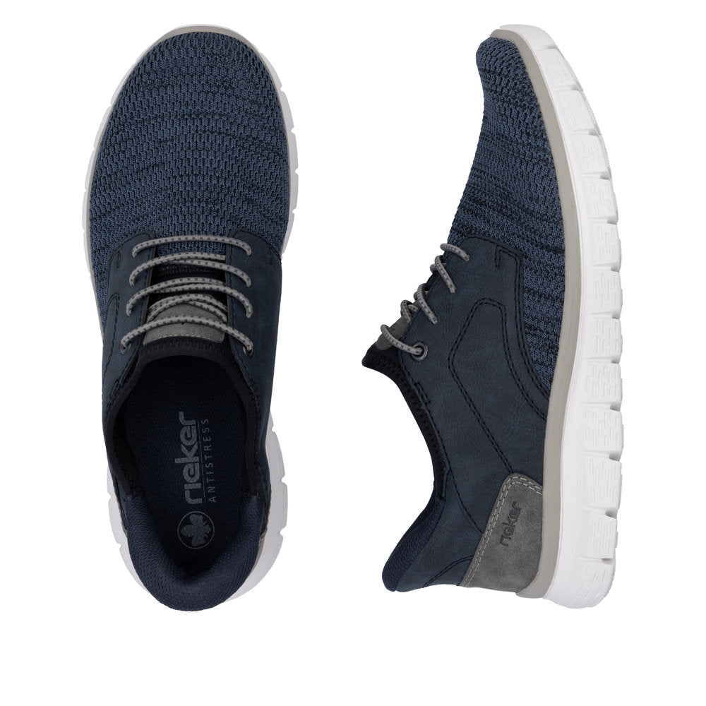 Pair of navy blue athletic shoes with gray laces and white soles.