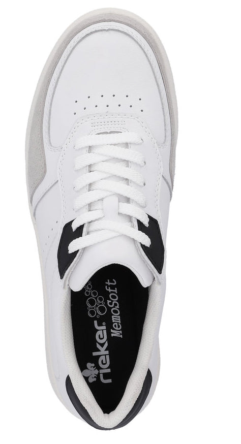 Overhead view of a white sneaker with white laces; black accents and 'Memosoft' branding visible on the insole.