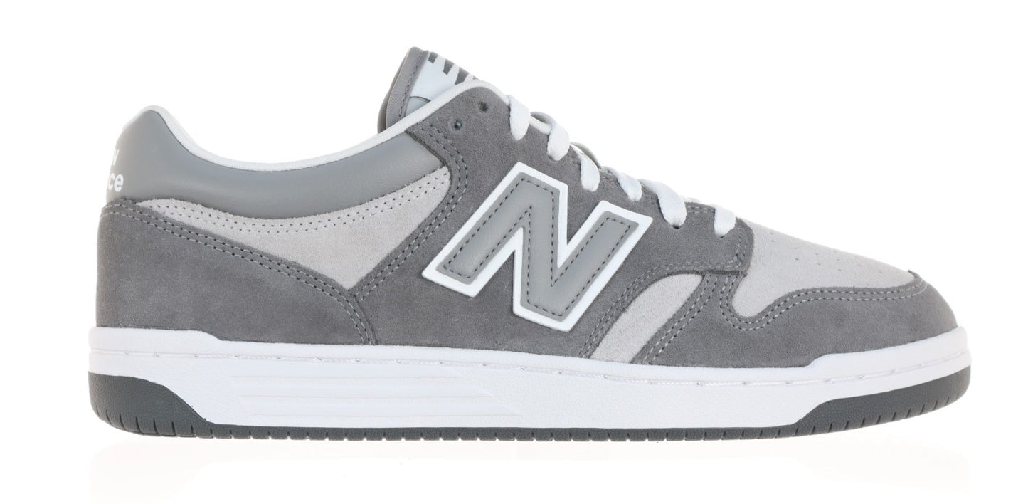 A gray sneaker with a white sole and 'N' logo.