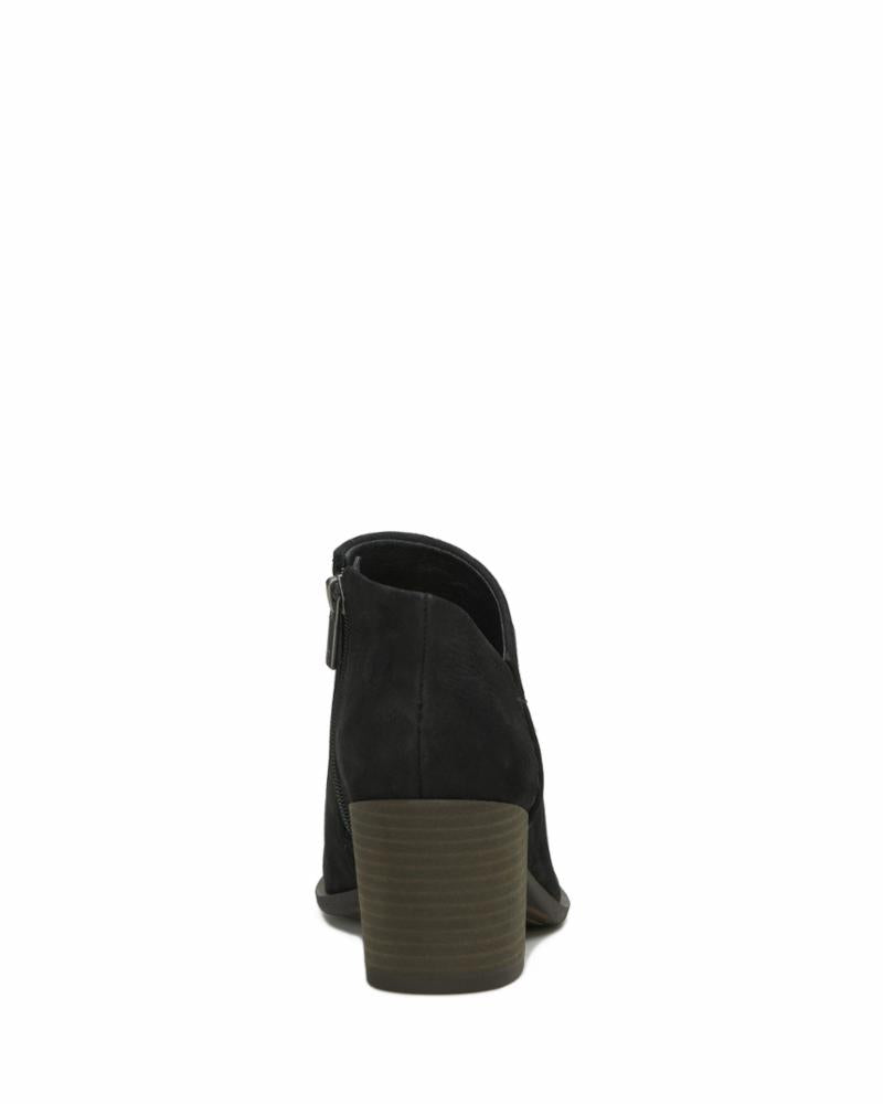 Black ankle boot with block heel and side zipper, rear view.