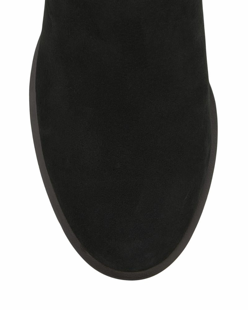 Close up of a rounded toe of a black boot.