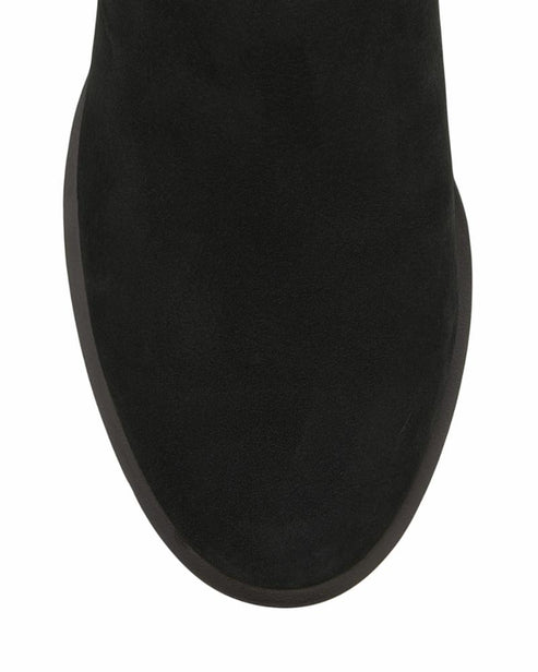 Close up of a rounded toe of a black boot.