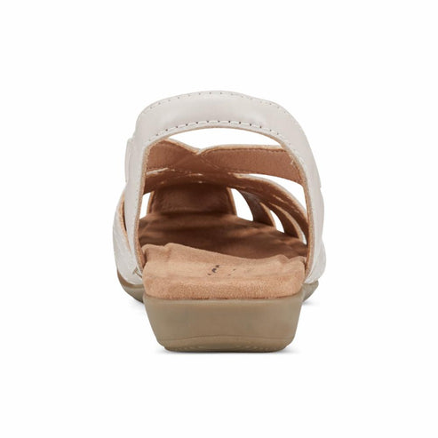 Rear view of an off-white sandal with multiple straps and a tan sole.
