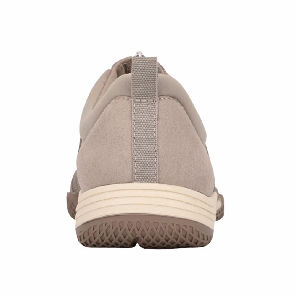 Back view of a tan slip-on shoe with a beige sole and a gray fabric pull tab.