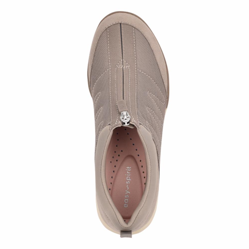 Top-down view of a beige casual shoe with a zipper and the text "easy-spirit" on the insole.