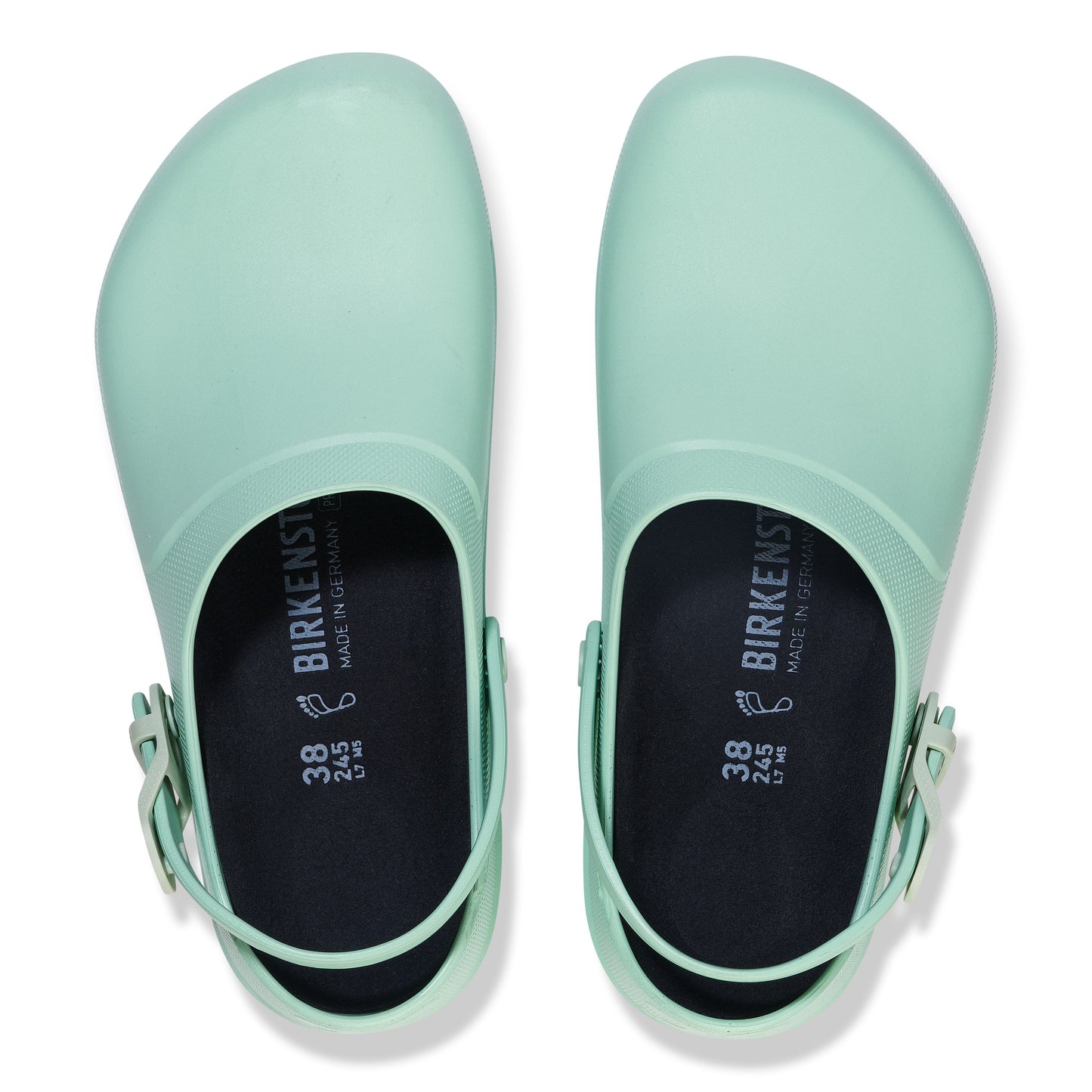 Overhead view of two mint-green clogs with adjustable heel straps and "BIRKENSTOCK MADE IN GERMANY 38" printed on the insole.
