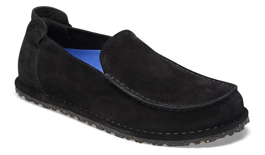 Black suede slip-on loafer with blue insole and textured sole.