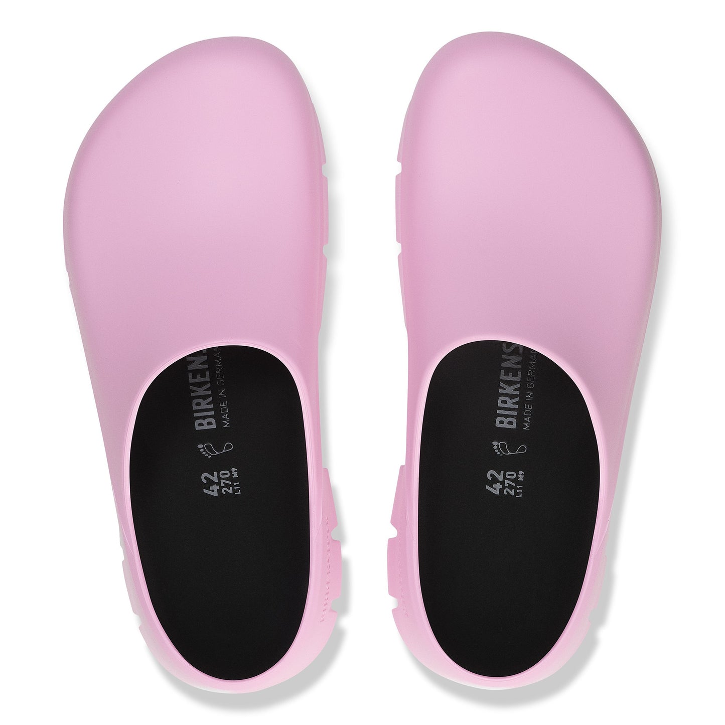 Overhead view of a pair of pink clogs with visible "BIRKENSTOCK" and size "42 270" text inside.
