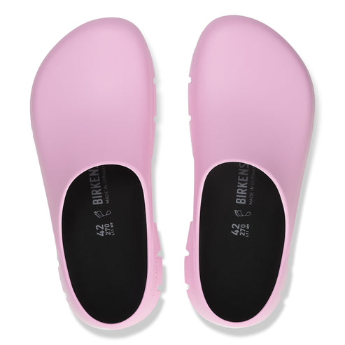 Overhead view of a pair of pink clogs with visible "BIRKENSTOCK" and size "42 270" text inside.