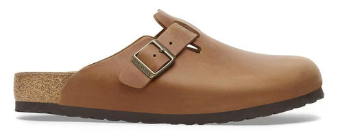 A brown clog with a buckle closure.
