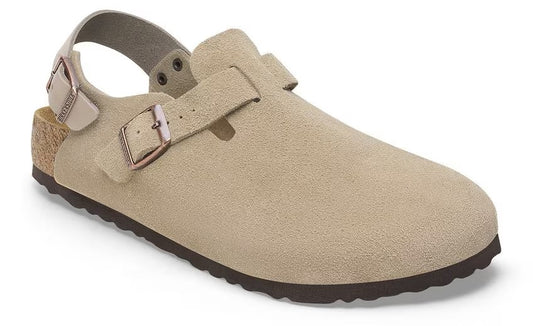 Beige suede clog with an adjustable top strap and a heel strap; it has a cork midsole and a dark brown outsole.
