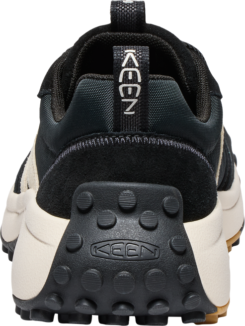 Rear view of a black and off-white shoe with visible KEEN branding.