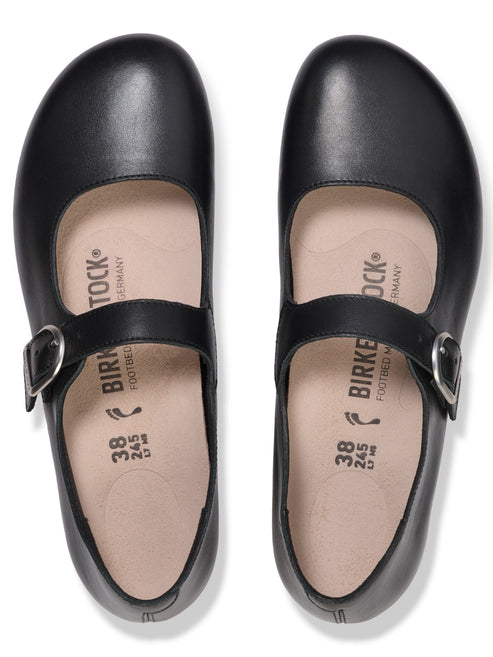 A pair of black leather Mary Jane-style shoes with a single buckled strap across the instep, shown from a top-down view, with the Birkenstock logo, size 38, and 245 mm printed on the light-colored insoles.
