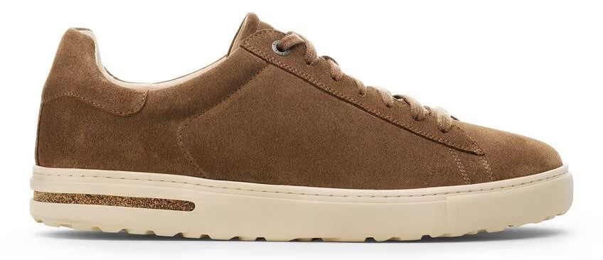 A brown suede sneaker with a white sole.