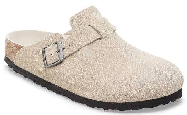 Beige suede clog with adjustable buckle and dark sole.