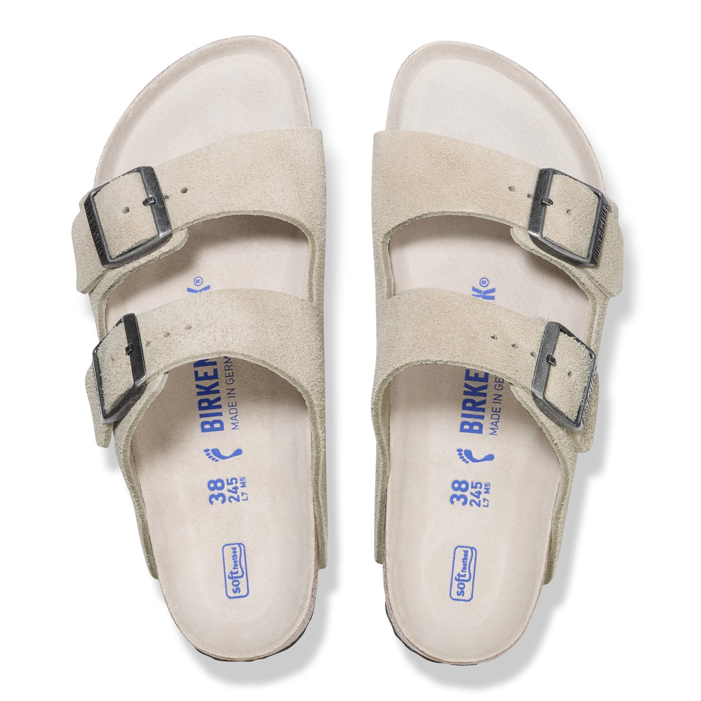 Two tan suede sandals with two adjustable straps each.