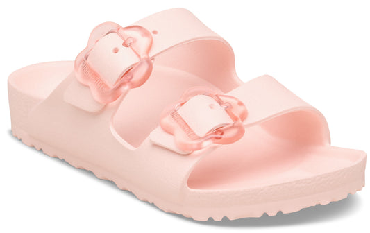 Pink sandal with two straps and flower-shaped buckles.