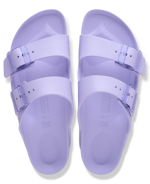 Pair of lavender plastic two-strap sandals with adjustable buckles, top view.
