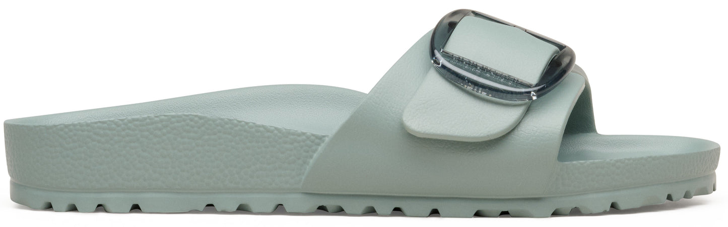 A slip-on sandal, light green, with an adjustable upper strap and silver buckle.