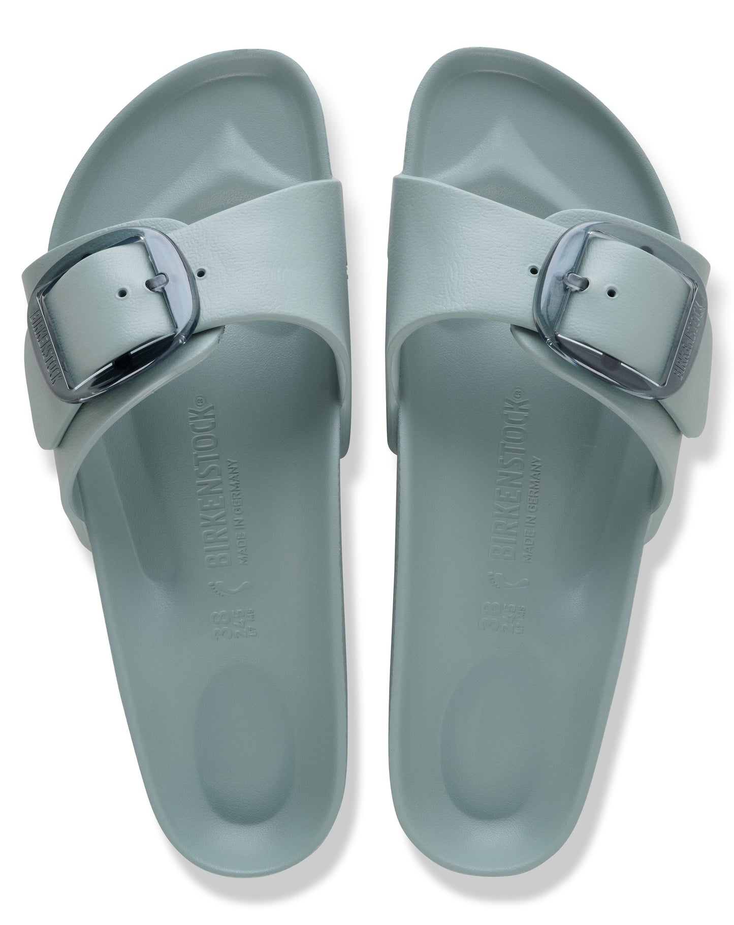 Two light blue slides with large buckle closures.