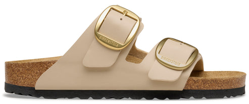 Two strap beige sandal with golden buckles.