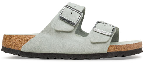 A pair of two-strap light green sandals with cork soles and metal buckles.