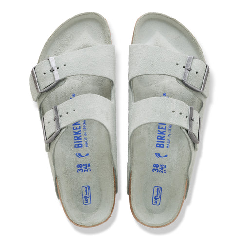 Pair of gray, two-strap sandals with silver buckles, size 38.