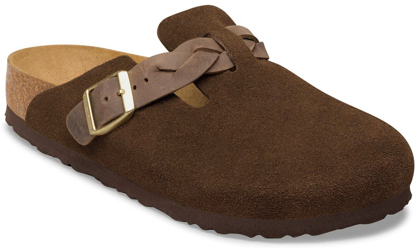 A brown suede mule-style shoe with a cork footbed, featuring a braided strap across the upper and a gold-toned adjustable metal buckle.