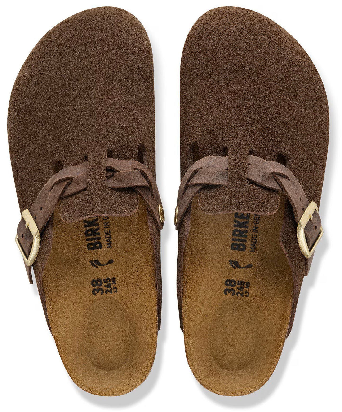 A pair of brown suede clogs, shown from a top-down perspective, featuring a braided leather strap with a gold-tone buckle over the instep, a molded cork footbed, and the text "BIRKENSTOCK" and size "38 245" printed on the heel.