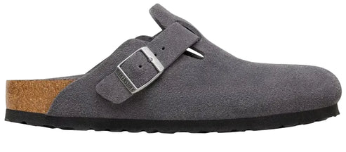 A gray suede clog with a cork midsole, a black rubber outsole, and a single adjustable silver-toned buckle strap with the brand name embossed on the metal.
