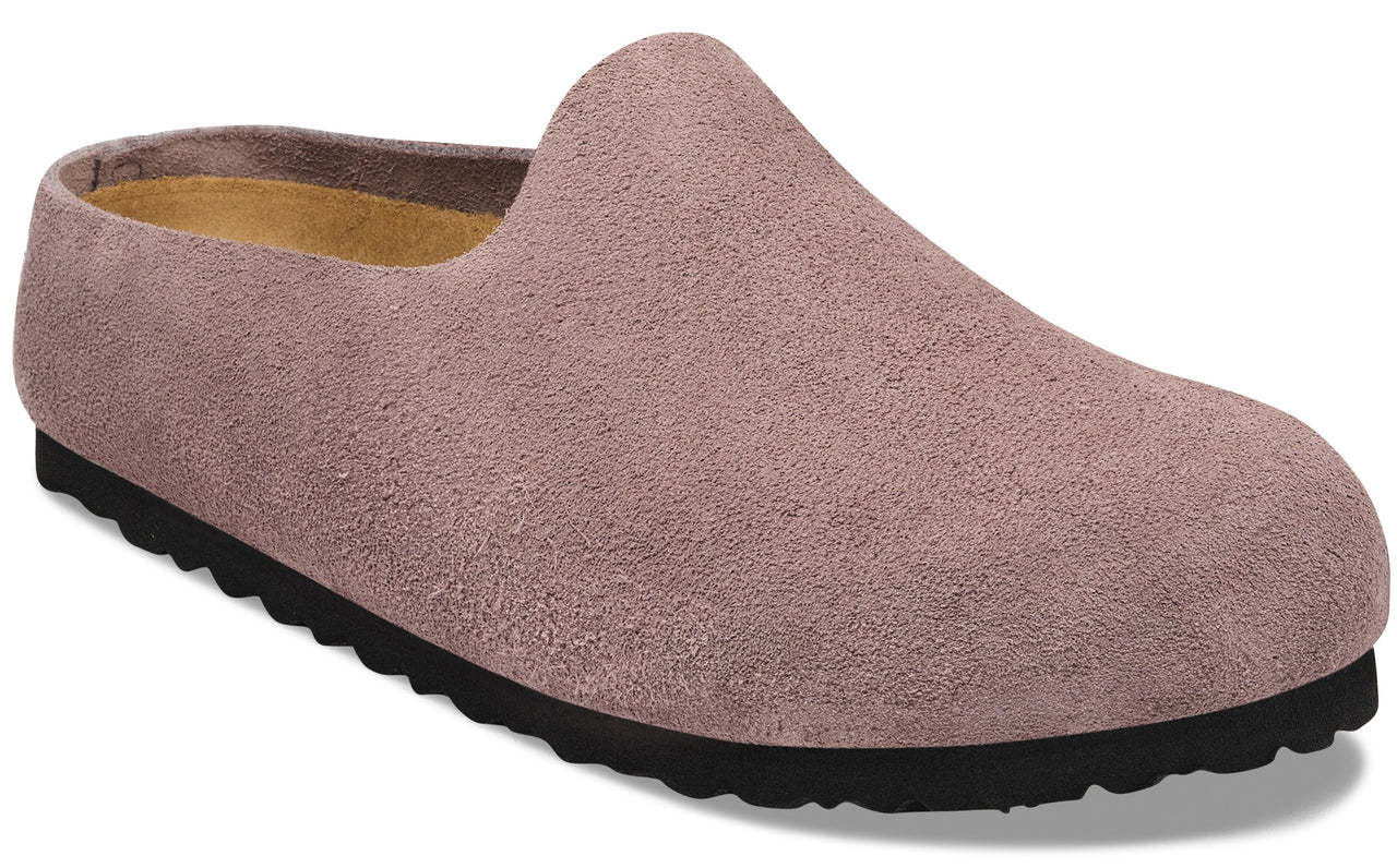 A slip-on suede clog in a dusty mauve color with a textured black rubber sole and a tan interior lining.