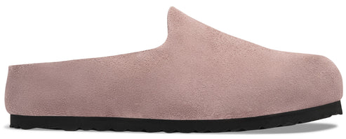 A minimalist, dusty rose suede slip-on mule shoe with a simple, rounded closed toe and a flat, thick black rubber sole.