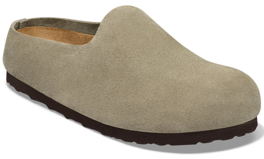 A slip-on clog made of light taupe suede with a dark brown, textured rubber sole.