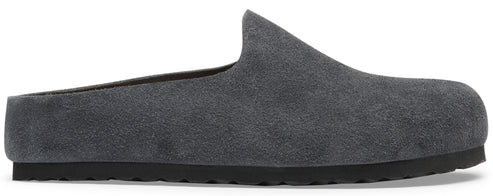 A minimalist dark grey suede mule slip-on shoe with a thick black textured rubber sole.