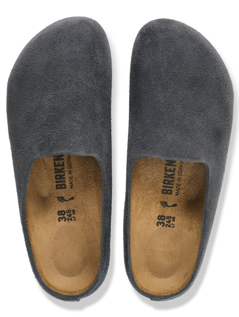 A pair of charcoal gray suede slip-on clogs with cork footbeds and visible size 38 markings inside.