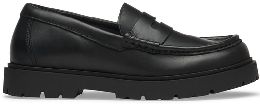 A black leather penny loafer with a chunky lug sole.