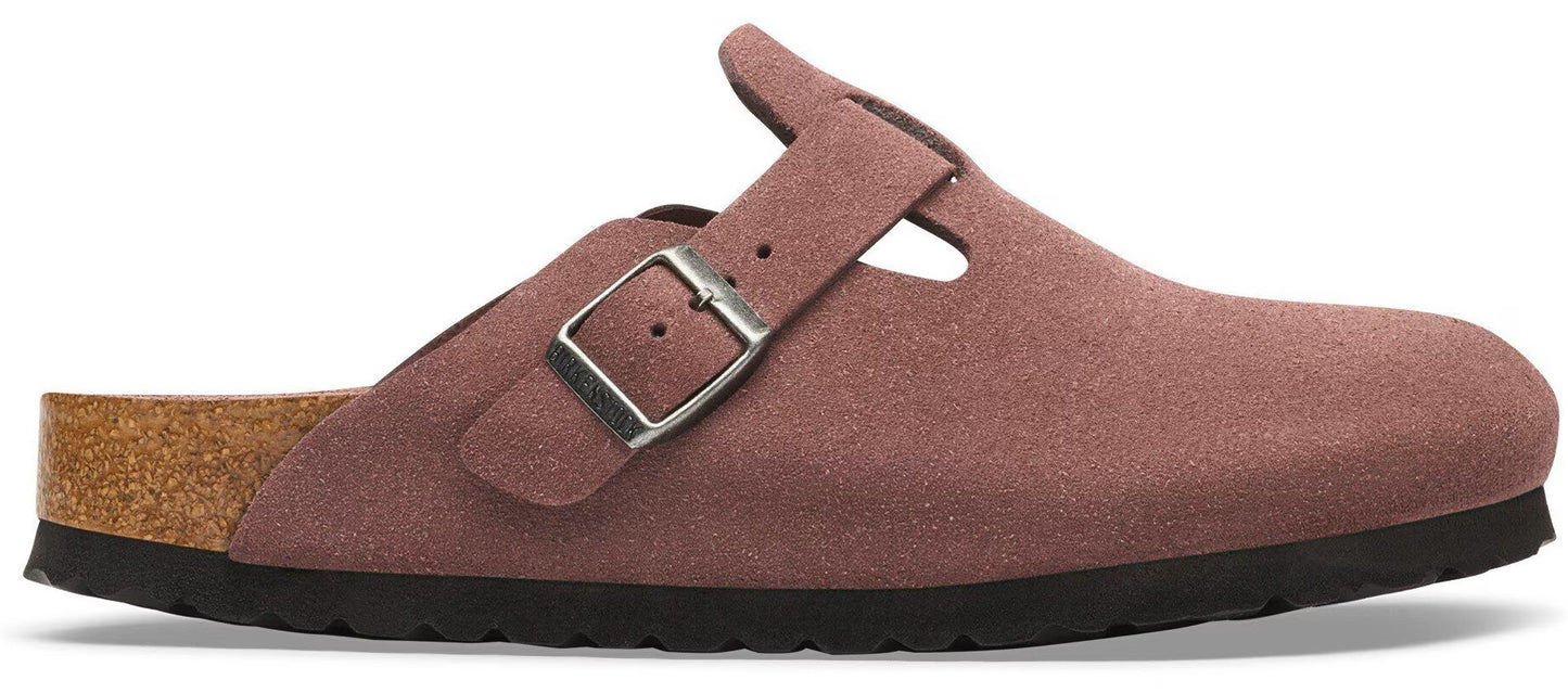 A mauve-colored suede mule clog with a single side buckle, a cork midsole, and a black treaded rubber outsole.