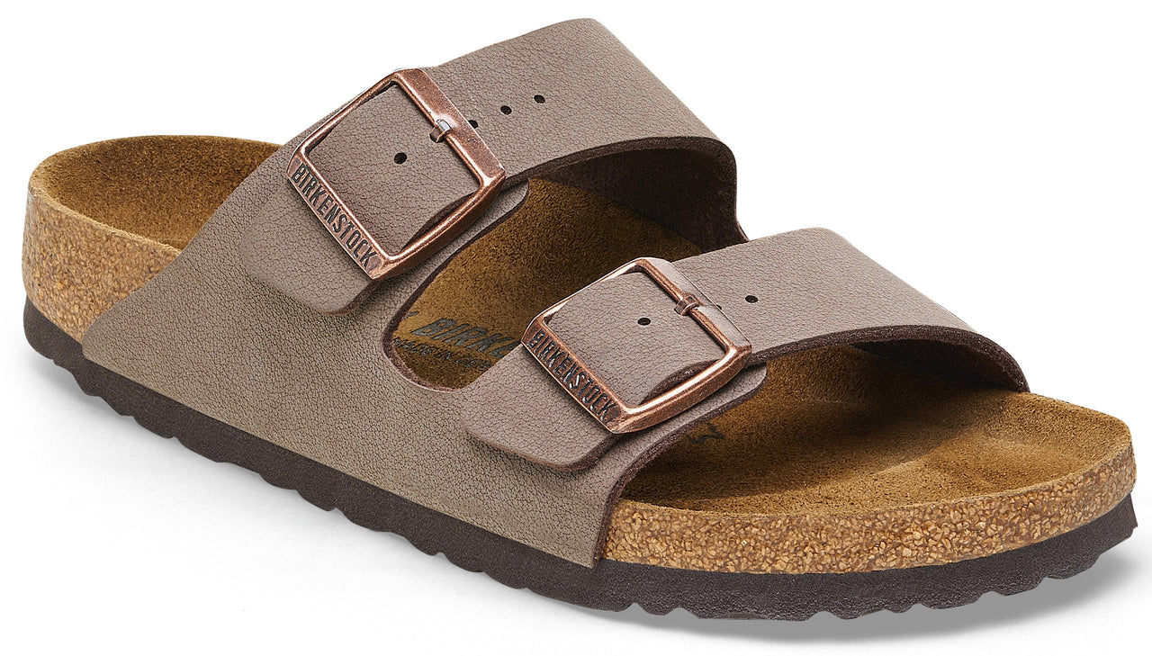 A brown suede two-strap sandal with adjustable buckles.