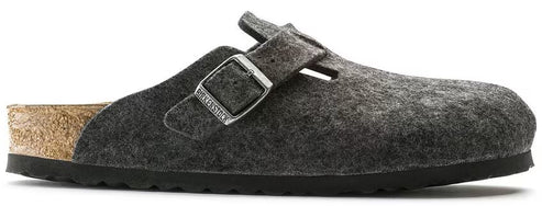 A clog-style shoe with a gray, felt-like upper, a cork sole, and an adjustable strap with a silver buckle.