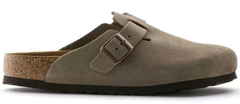 A tan suede clog with an adjustable buckle.