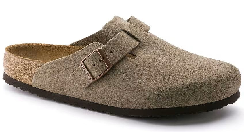 Taupe clog with suede upper and adjustable buckle strap, cork footbed, and black sole.