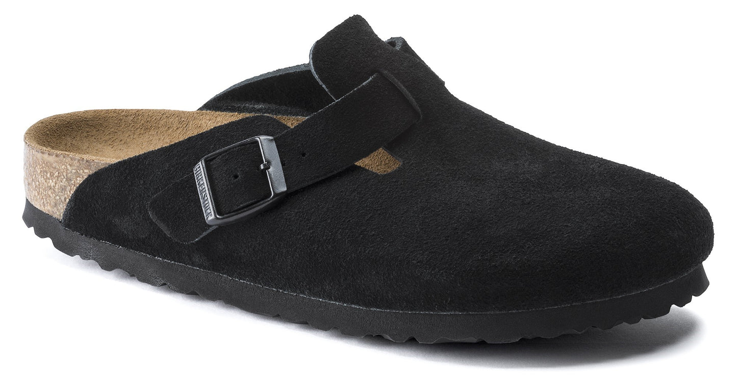 Black suede clog with a buckled strap.