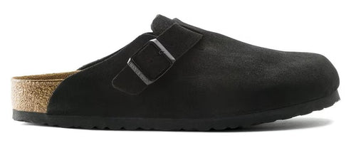 A black, suede clog-style shoe with a buckle strap and cork sole.