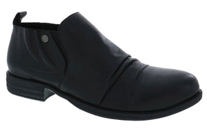 Black leather ankle boot with low heel and elastic side.