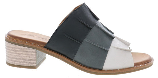 A women's heeled sandal with a layered multi-tone upper.