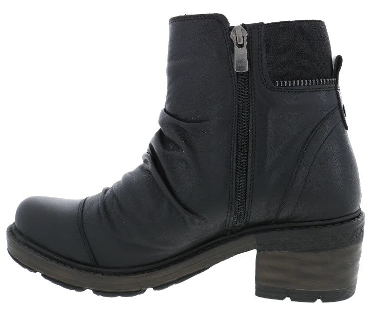 A black ankle boot with a side zipper, ruched detailing on the shaft, and a thick, textured, dark-toned block heel.