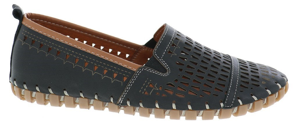 A black slip-on shoe with a tan sole and interior, featuring decorative perforations and stitching.