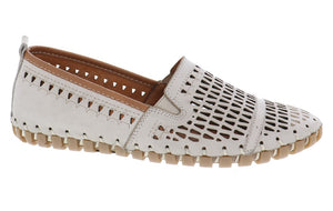 Off-white leather slip-on shoe with decorative cutouts and a tan sole.